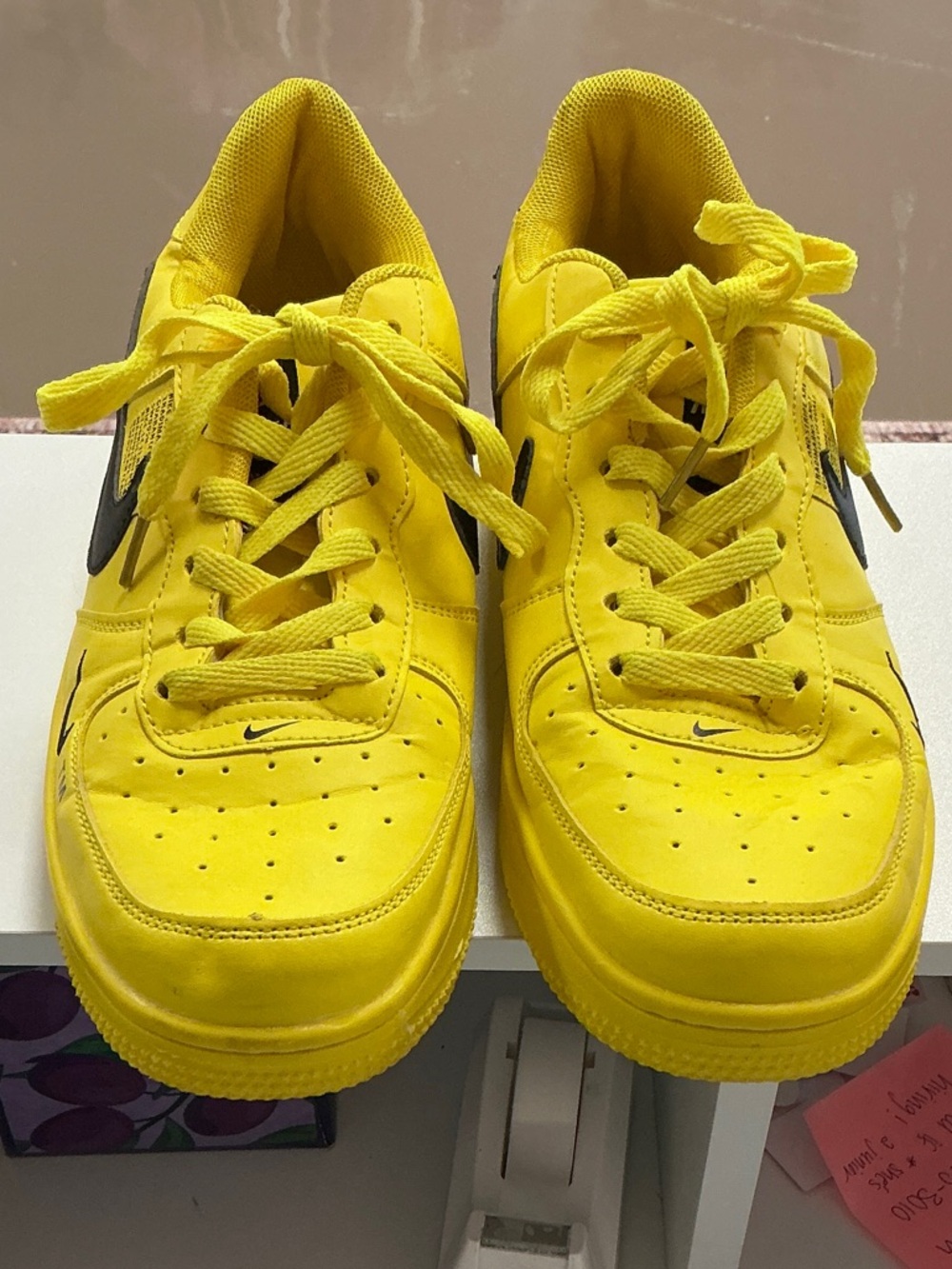 Nike Yellow Low-Top Sneakers with Black Swoosh